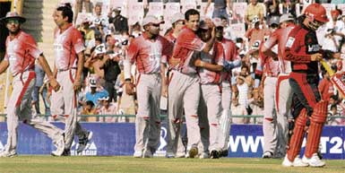 Kings XI Punjab players celebrate the dismissal of Delhi Daredevils skipper Virender Sehwag in the DLF IPL match at the PCA Stadium on Sunday. Sehwag contributed six runs as visitors put 158 on the board. Punjab achieved the target losing six wickets.