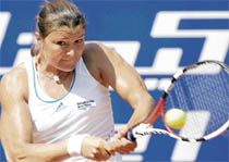 Russia�s Dinara Safina returns to Victoria Azarenka of Belarus during the semifinal at the German Open in Berlin on Saturday.