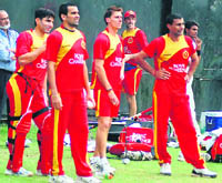 (From left): Misbah-ul Haq, Zaheer Khan, Dale Steyn and Praveen Kumar of Bangalore Royal Challengers warm up on Sunday for the DLF IPL T20 match against Kings XI Punjab at the PCA Stadium in Mohali on Monday. On the extreme left is Brijesh Patel, team CEO.