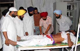 Jugraj Singh, a supporter of SAD (B), attacked by SAD (A) workers, undergoing treatment at the Civil Hospital in Moga.