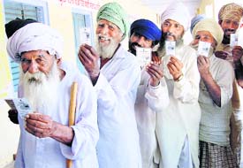 Elderly rural folk line up to exercise their franchise in Zila Parishad and Panchayat Samiti elections in Amritsar on Monday.
