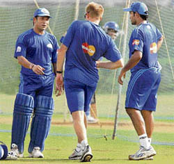Mumbai Indians' skipper Sachin Tendulkar with teammates at the nets.