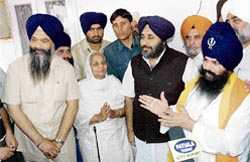 SAD chief Sukhbir Singh Badal (third from left) with Baba Santa Singh�s sister Kishan Kaur and new Nihang chief Baba Balbir Singh at Bagichi Baba Bamba Singh in Patiala 