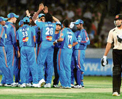 Mumbai Indians team celebrate the wicket of Deccan Chargers� Rohit Sharma during the IPL T20 match at Rajiv Gandhi International Cricket Stadium Uppal in Hyderabad on Sunday. 