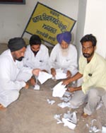 Candidates along with their supporters showing the torn lists of poll symbols allotted to them in Talwandi Sabo
