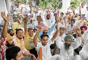 Activists of the Amritsar Rural Congress gherao the office of the ADC (Development) against the rejection of the nomination papers of their candidates for the Panchayat polls in Amritsar on Tuesday. 