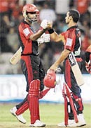 Daredevils� Shikhar Dhawan and Farveez Maharoof after their team�s win against Bangalore Royal Challengers