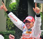 McLaren Formula One driver Lewis Hamilton of Britain celebrates after winning the Monaco F1 Grand Prix in Monte Carlo on Sunday. 
