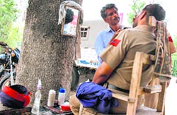 A Punjab police cop on duty during the Gujjar protest finds time for a shave in Patiala