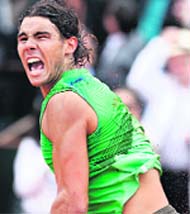 Spain's Rafael Nadal celebrates after defeating Serbia's Novak Djokovic in their semi-final match at the French Open tennis tournament. Nadal won 6-4 6-2 7-6. 