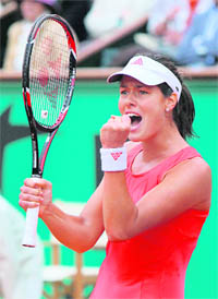 Serbia�s Ana Ivanovic celebrates after defeating Russia�s Dinara Safina in the French Open final match at Roland Garros in Paris on Saturday. Ivanovic won 6-4, 6-3.