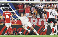 Germany's Lukas Podolski (R) scores his second goal as Poland's Michal Zewlakow (L)and Artur Boruc react during their Group B Euro 2008 soccer match at the Woerthersee Stadium in Klagenfurt, on Sunday.