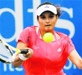 Sania Mirza hits a shot during her second-round match against Marina Erakovic of New Zealand, at the Birmingham DFS Classic women's tennis tournament, Birmingham, England, on Wednesday. Erakovic defeated Sania 6-3, 6-0