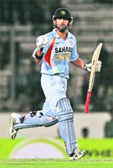India�s Gautam Gambhir celebrates after completing his century during the third ODI tri-series match against Bangladesh at the Sher-e-Bangla Cricket Stadium in Dhaka on Thursday.