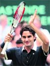 Roger Federer of Switzerland celebrates after defeating Philipp Kohlschreiber of Germany to win the final of the Halle Open ATP tennis tournament in Halle on Sunday. � Reuters