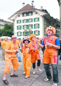 Dutch fans play as they gather before the Euro 2008 soccer match between the Netherlands and Romania at a fan zone in Bern