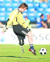A disabled soccer player takes part in a demonstration match before the quarterfinal between Russia and the Netherlands at St Jakob Park stadium in Basel