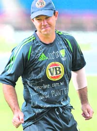 Australian cricket captain Ricky Ponting wears a training shirt signed by his team mates prior to their second one-day cricket international against West Indies in St. George's, Grenada