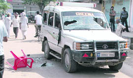 A vehicle damaged in poll violence at Maur Mandi in Bathinda on Monday.