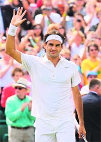 Roger Federer of Switzerland celebrates after beating Lleyton Hewitt of Australia 7-6, 6-2, 6-4, during the 2008 Wimbledon Championships at the All England Tennis Club in south-west London