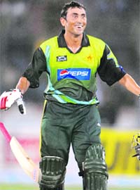 Younis Khan celebrates after scoring a century against India during the Super League Asia Cup match between Pakistan and India at National Stadium in Karachi