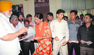 Irrigation minister Janmeja Singh Sekhon with candidates in Chandigarh on Friday. 