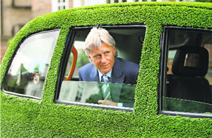 Five times Wimbledon singles champion Bjorn Borg of Sweden departs in a grass covered taxi in London after speaking with reporters Friday. Borg has been watching the 2008 championships at Wimbledon and will attend the men's final on Sunday.