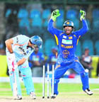 Sri Lanka spinner Ajantha Mendis (L) celebrates after taking the wicket of Suresh Raina during the Asia Cup final, while Yuvraj Singh (M) and Suresh Raina after being castled during the Asia Cup final at the National Cricket Stadium in Karachi on Sunday.