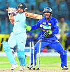 Sri Lanka spinner Ajantha Mendis (L) celebrates after taking the wicket of Suresh Raina during the Asia Cup final, while Yuvraj Singh (M) and Suresh Raina after being castled during the Asia Cup final at the National Cricket Stadium in Karachi on Sunday.