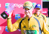 Australia's captain Michael Clarke holds up the one-day cricket international series trophy after they defeated West Indies in the final match in Basseterre, St. Kitts on Sunday.