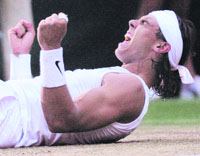Rafael Nadal of Spain celebrates defeating Roger Federer of Switzerland in their finals match at the Wimbledon tennis championships in London on Sunday.