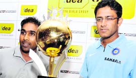 Sri Lankan captain Mahela Jayawardene (L) and his Indian counterpart Anil Kumble pose with a trophy at a press conference in Colombo on Tuesday at the launch of India�s tour of Sri Lanka. The teams will play three Test matches and five ODIs starting July 23.