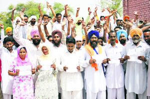 Panches of Channu village and their supporters protest the alleged interference of the Badal family in the election of the sarpanch at the village on Wednesday. 
