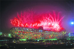 Fireworks explode over the National Stadium, also known as the Bird's Nest, during a rehearsal for the opening ceremony of the 2008 Beijing Olympic Games at the Olympic Green in Beijing