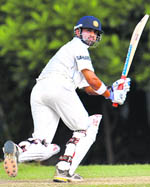 Gautam Gambhir hits a stroke on the third day of the three-day practice match between India and Sri Lanka Board XI team in Colombo on Sunday. 