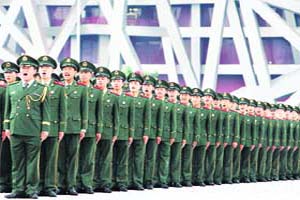 Chinese paramilitary policemen chant slogans near the National Stadium also called the Bird�s Nest at the Olympic Green in Beijing