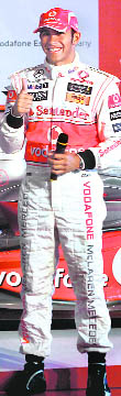 British McLaren F1 motor racing driver Lewis Hamilton gestures during a promotional event in Mumbai on Thursday.