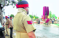  policeman stands guard ahead of the inauguration of a statue of Shaheed Udham Singh by Chief Minister Parkash Singh Badal 