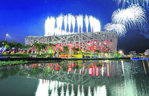 Fireworks illuminate the Olympic Village as a rehearsal for the Beijing 2008 Olympic Games opening ceremony goes underway at Beijing's National Stadium on Saturday.