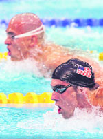 US swimmer Michael Phelps competes next to Hungary's Laszlo Cseh (top) during the men's 400m individual medley swimming final at the National Aquatics Centre during the 2008 Beijing Olympic Games on Sunday.