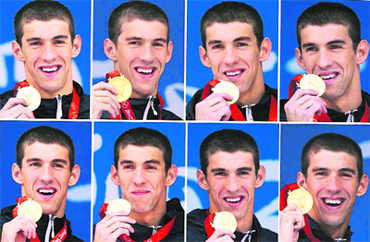 This combination of photos shows Michael Phelps holding each of his eight gold medals after the 400m individual medley, 4 x 100m freestyle relay, 200m freestyle, 200m butterfly, 4 x 200m freestyle relay, 200m individual medley, 100m butterfly and the 4x100-meter medley relay at the Beijing 2008 Olympics in Beijing.