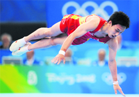 China's Kai Zou competes in the men's floor exercise final of the artistic gymnastics event of the Beijing 2008 Olympic Games in Beijing on Sunday. Zou tightened China's stranglehold in the men's Olympic gymnastics when he tumbled to glory on the floor after favourites Diego Hypolito and Marian Dragulescu fluffed their routines.