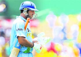 Yuvraj Singh walks back to the pavilion after his dismissal during the first ODI between Sri Lanka and India at the Rangiri Dambulla International Cricket stadium in Dambulla