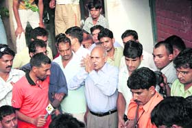 Akhil Kumar�s father wears a dejected look as he thanks the media, who had arrived at their home in Rohtak, after his son lost his quarterfinal bout at the Beijing Olympics