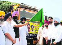 Bikramjit Singh Majithia flags off trucks carrying relief material for the flood-hit in Ludhiana on Wednesday.