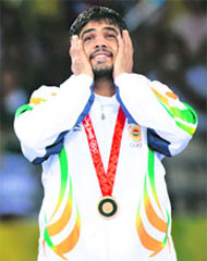 Bronze medallist Sushil Kumar of India attends the medal ceremony for the 66kg men's freestyle wrestling at the Beijing 2008 Olympic Games on Wednesday.