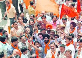 BJP MP Navjot Singh Sidhu along with party workers during a protest rally in Amritsar on Thursday.