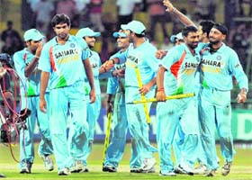 Victorious Indian cricketers walk off the pitch after defeating Sri Lanka by 46 runs in the fourth ODI in Colombo