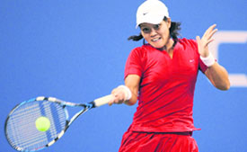 Na Li of China returns a shot to Elena Dementieva of Russia during a US Open fourth round match at the USTA Billie Jean King National Tennis Centre. Dementieva won 6-4, 6-1. 