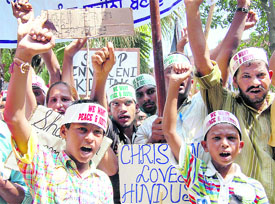 Members of the Christian community raise slogans against the Orissa government for its failure to protect Christians in Amritsar on Wednesday.